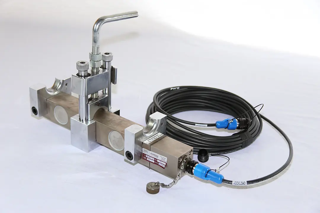 Stainless steel hookload sensor with a T-handle clamp and a coiled cable labelled Hookload.